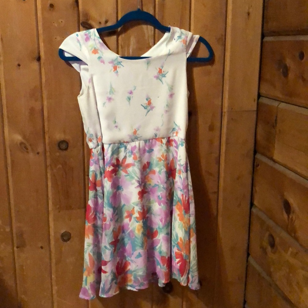 A floral dress with a bow in the back - kids 12